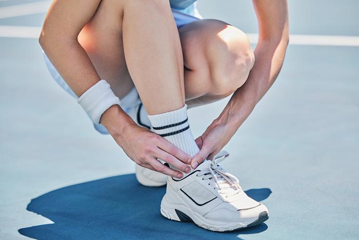 ankle-pain-of-tennis-player-woman-on-sports-groun