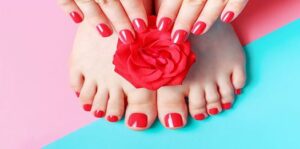 female-hands-with-manicure-and-feet-with-pedicure